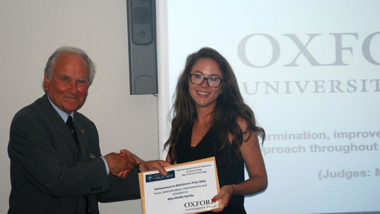 Professor Sir Richard Gardner presenting the Achievement in Biosciences Award 2015/2016 to Miss Shelby Sparby.